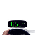 Solray Solar GPS HUD projecting speed onto a car windshield during daylight.
